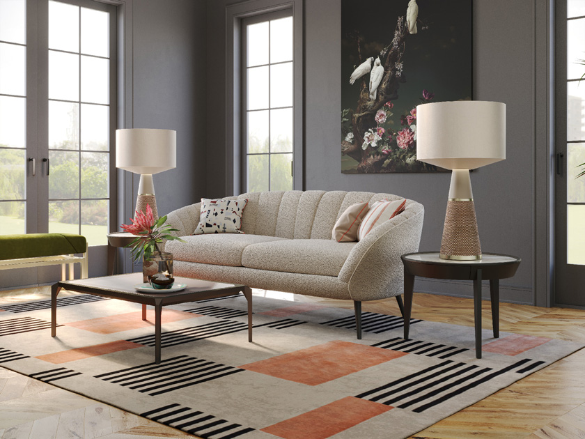 Image description: Living room in earth tones with settee, coffee table, side tables, table lamps and bench.