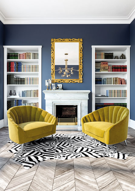 Image description: yellow velvet armchairs in an office reading corner.