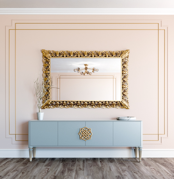 Image Description: decorative mirror in gilt carving, above light blue sideboard.