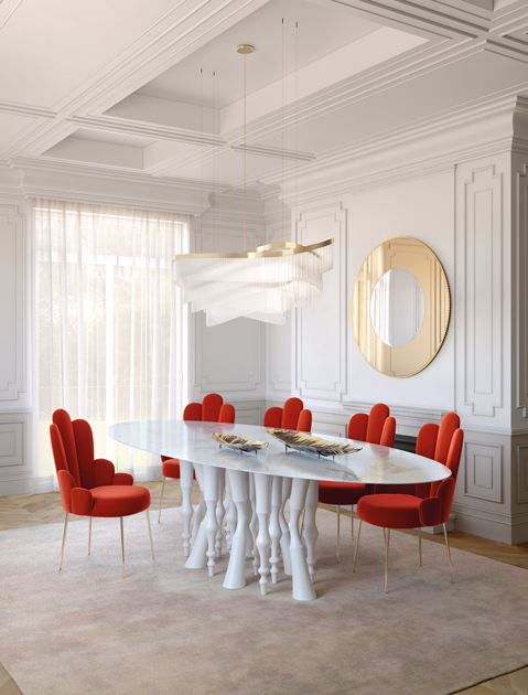 Image description: Red chairs and dining table with feet like horse legs and marble top