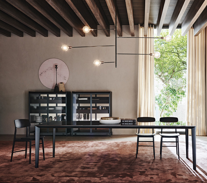 Image Description: chair for dining room by Molteni, model Woody with dining table and a Bookcase behind.