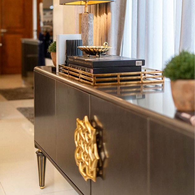 Image description: interiors photography of a sideboard detail in a living room, a project by Clove Republic.