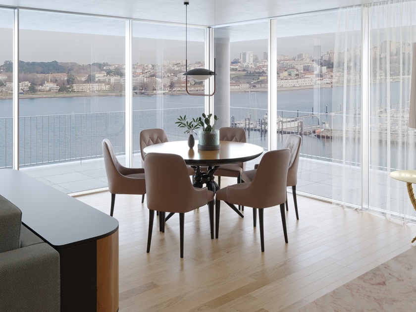Image description: Small dining room by windows with light curtains to make the space look bigger.